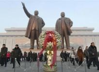 north-koreans-offer-flowers-to-bronze-statues-of-north-koreas-late-founder-kim-il-sung-and-late-leader-kim-jong-il-r-at-mansudae-in-pyongyang-in-this-picture-taken-and-provided-by-kyodo-december-17-2013-to-mark-the-second-death-anniversary-of-kim-jo