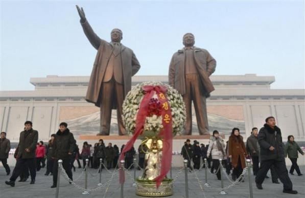 North Koreans offer flowers to bronze statues of North Korea's late founder Kim Il Sung and late leader Kim Jong Il (R) at Mansudae in Pyongyang, in this picture taken and provided by Kyodo December 17, 2013, to mark the second death anniversary of Kim Jong Il. North Koreans offer flowers to bronze statues of North Korea's late founder Kim Il Sung and late leader Kim Jong Il (R) at Mansudae in Pyongyang, in this picture taken and provided by Kyodo December 17, 2013, to mark the second death anniversary of Kim Jong Il.
