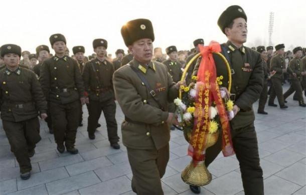 North Korean soldiers offer flowers to bronze statues (not pictured) of North Korea's late founder Kim Il Sung and late leader Kim Jong Il at Mansudae in Pyongyang, in this picture taken and provided by Kyodo December 17, 2013, to mark the second death anniversary of Kim Jong Il North Korean soldiers offer flowers to bronze statues (not pictured) of North Korea's late founder Kim Il Sung and late leader Kim Jong Il at Mansudae in Pyongyang, in this picture taken and provided by Kyodo December 17, 2013, to mark the second death anniversary of Kim Jong Il