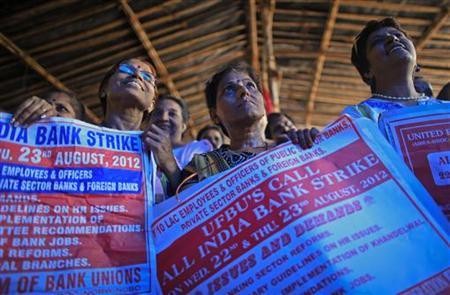 Bank employees hold placards at a rally during a two-day strike in Mumbai August 22, 2012