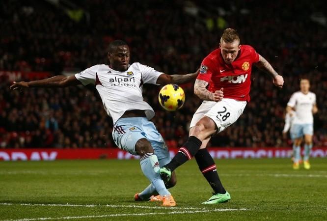 West Ham defender Guy Demel challenges Manchester United's Alex Buttner in their English Premier League game, December 21. Reuters West Ham Demel Manchester United Buttner