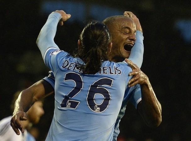 Manchester City skipper Vincent Kompany celebrates with teammate Martin Demichelis after scoring against Fulham in the English Premier League, December 21. Reuters Kompany Demichelis Manchester City