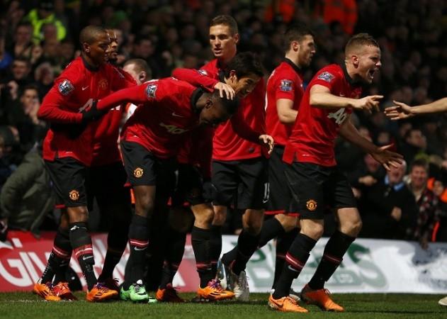 Danny Welbeck is congratulated by his Manchester United teammates after scoring the winner against Norwich in the English Premier League, December 28. Reuters Welbeck Manchester united Vidic Young Cleverley