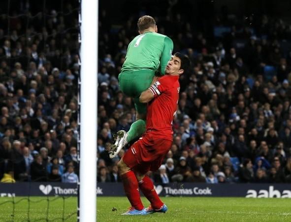 Liverpool forward Luis Suarez clashes with Manchester City goalkeeper Joe Hart in their English Premier League game, December 26. Reuters Luis Suarez Liverpool Joe Hart Manchester City