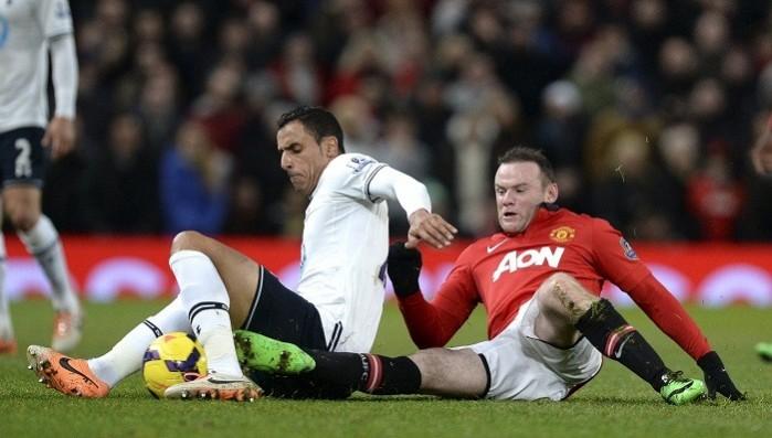 Manchester United forward Wayne Rooney challenges Tottenham winger Nacer Chadli during their English Premier League game, January 1. Reuters Chadli Tottenham Rooney Manchester United