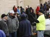 a-staffer-talks-to-people-waiting-in-line-to-be-among-the-first-to-legally-buy-recreational-marijuana-at-the-botana-care-store-in-northglenn-colorado-january-1-2014