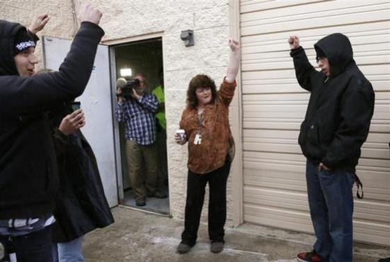 Cheri Hackett, (C) co-owner of the Botana Care marijuana store celebrates just before opening her doors to customers for the first time in Northglenn, Colorado January 1, 2014 Cheri Hackett, (C) co-owner of the Botana Care marijuana store celebrates just before opening her doors to customers for the first time in Northglenn, Colorado January 1, 2014