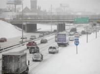 motorist-drive-along-a-snow-covered-interstate-94-in-detroit-michigan-january-2-2014