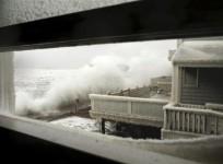 waves-crash-into-houses-on-lighthouse-road-during-a-winter-noreaster-snow-storm-in-scituate-massachusetts-january-3-2014