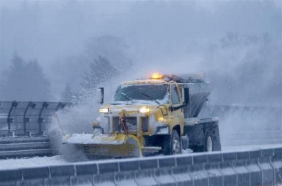 A snow plow clears the road of snow along the New York State Thruway Interstate 87 in Tarrytown, New York A snow plow clears the road of snow along the New York State Thruway Interstate 87 in Tarrytown, New York