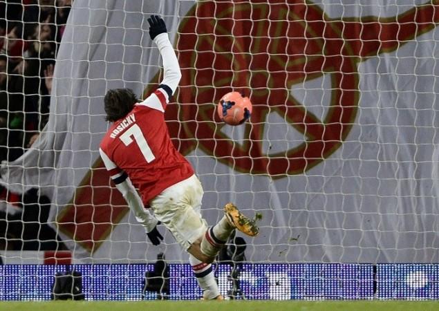 Tomas Rosicky scores Arsenal's second goal against Tottenham in their FA Cup third round match, January 4. Reuters Arsenal Tomas Rosicky