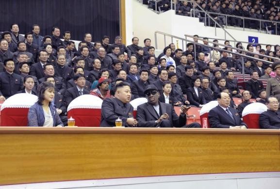 North Korean leader Kim Jong-Un (2nd L), his wife Ri Sol-Ju (L) and former NBA player Dennis Rodman (3rd L) watch an exhibition basketball game in Pyongyang