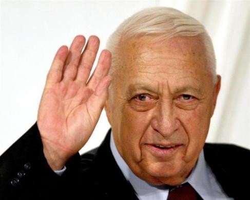 Israeli Prime Minister Ariel Sharon gestures at the end of his Likud Party's women conference in Tel Aviv in this March 10, 2005