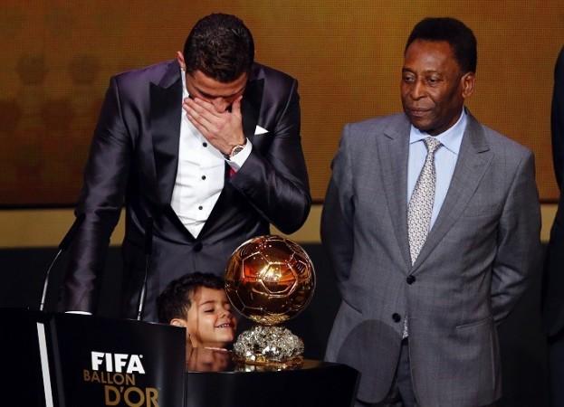 Cristiano Ronaldo cannot hide his emotions after winning the FIFA Ballon d'Or as son and Brazil legend Pele looks on, January 13. Reuters Cristiano Ronaldo Son Pele