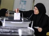 a-woman-casts-her-vote-at-a-polling-centre-during-a-referendum-on-egypts-new-constitution-in-cairo-january-14-2014