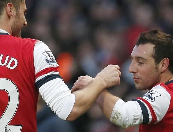 Arsenal playmaker Santi Cazorla celebrates with teammate Olivier Giroud after scoring against Fulham in the English Premier League, 18 January. Reuters Giroud Cazorla Arsenal