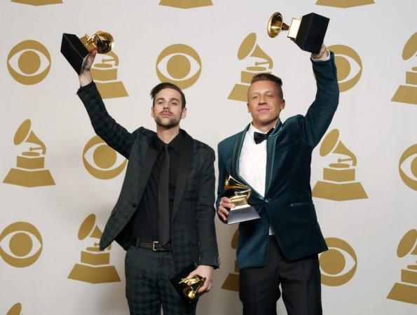 Hip hop artists Macklemore and Lewis pose backstage with their awards for Best New Artist, Best Rap Performance for Macklemore and Lewis