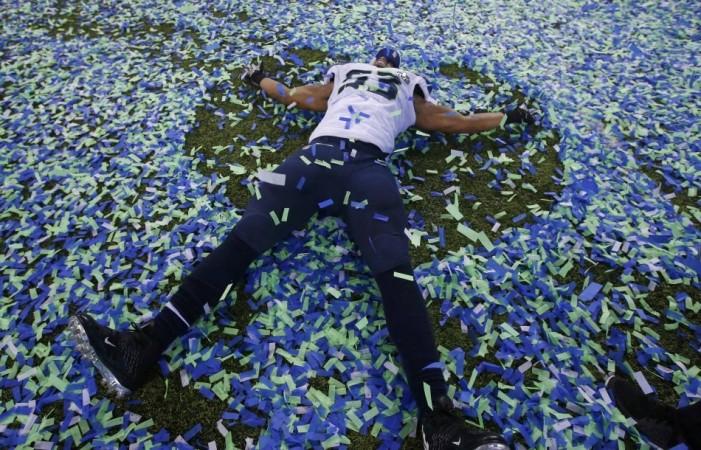 Seattle Seahawks Malcom Smith makes an angel in the confetti after his team defeated the Denver Bronocs in the NFL Super Bowl XLVIII football game in East Rutherford, New Jersey, February 2, 2014. REUTERS/Shannon Stapleton Seattle Seahawks Malcom Smith makes an angel in the confetti after his team defeated the Denver Bronocs in the NFL Super Bowl XLVIII football game in East Rutherford, New Jersey, February 2, 2014. REUTERS/Shannon Stapleton