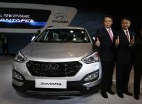 senior-executives-of-hyundai-motors-india-limited-hmil-pose-with-hyundais-santa-fe-car-during-its-launch-at-the-auto-expo-in-greater-noida-on-the-outskirts-of-new-delhi-on-february-5-2014