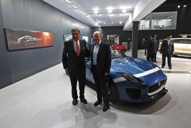 Indian businessman Ratan Tata, former chairman of the Tata Group, and Ian Callum (R), design director at Jaguar, stand next to the Jaguar Project 7 concept car during the Indian Auto Expo in Greater Noida, on the outskirts of New Delhi, February 5, 2014. REUTERS/Adnan Abidi Auto Expo 2014