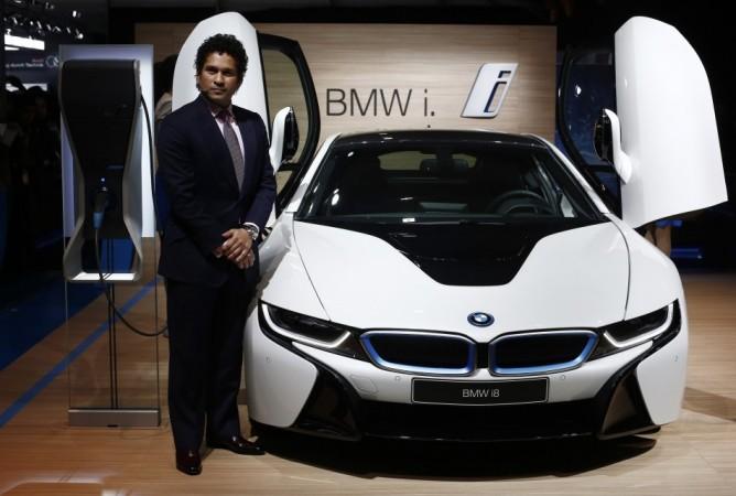 Indian businessman Ratan Tata, former chairman of the Tata Group, and Ian Callum (R), design director at Jaguar, stand next to the Jaguar Project 7 concept car during the Indian Auto Expo in Greater Noida, on the outskirts of New Delhi, February 5, 2014. REUTERS/Adnan Abidi Auto Expo 2014