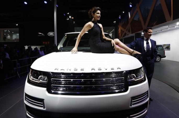 Bollywood actress Priyanka Chopra poses with Jaguar Land Rover's Range Rover LWB during its launch at the Indian Auto Expo in Greater Noida, on the outskirts of New Delhi, February 5, 2014. REUTERS/Adnan Abidi Auto Expo 2014