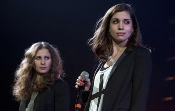 Russian punk band Pussy Riot members Maria Alyokhina (L) and Nadezhda Tolokonnikova speak on stage during Amnesty International's Russian punk band Pussy Riot members Maria Alyokhina (L) and Nadezhda Tolokonnikova speak on stage during Amnesty International's