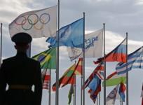 a-russian-soldier-stands-in-front-of-the-flags-during-the-welcoming-ceremony-for-the-u-s-olympic-team-in-the-athletes-village-at-the-olympic-park-ahead-of-the-2014-winter-olympic-games-in-sochi-february-6-2014-reuters-laszlo-balogh