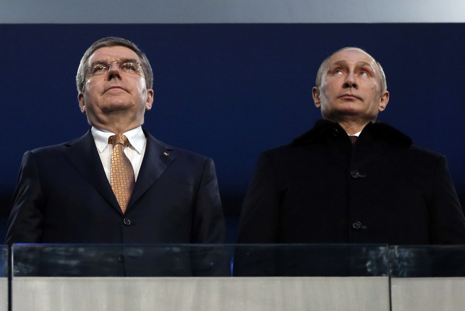 International Olympic Committee (IOC) President Thomas Bach of Germany and Russian President Vladimir Putin (R) stand together during the opening ceremony of the 2014 Sochi Winter Olympics, February 7, 2014.  Sochi Olympics 2014