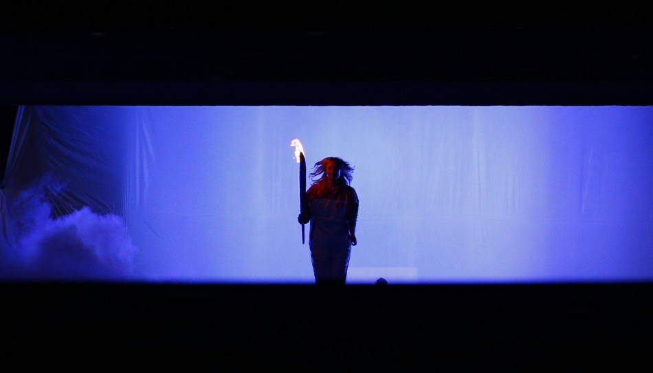 Russian tennis player Maria Sharapova holds the Olympic Torch during the opening ceremony of the 2014 Sochi Winter Olympic Games February 7, 2014.  Sochi Olympics 2014