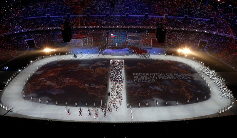 A map of Russia is projected onto the stadium floor as athletes march in during the opening ceremony of the 2014 Sochi Winter Olympics, February 7, 2014. Sochi Olympics 2014