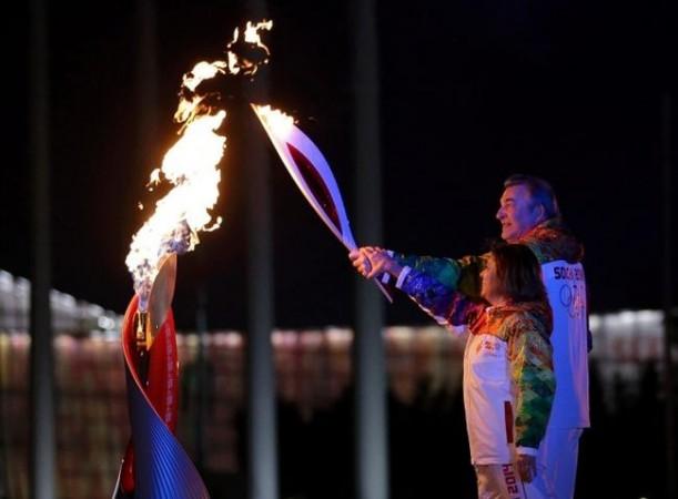 Former hockey player Vladislav Tretiak (back) and figure skater Irina Rodnina light the Olympic cauldron during the opening ceremony of the 2014 Sochi Winter Olympics, Feb. 7, 2014. (MATT SLOCUM/Reuters) Former hockey player Vladislav Tretiak (back) and figure skater Irina Rodnina light the Olympic cauldron during the opening ceremony of the 2014 Sochi Winter Olympics, Feb. 7, 2014. (MATT SLOCUM/Reuters)