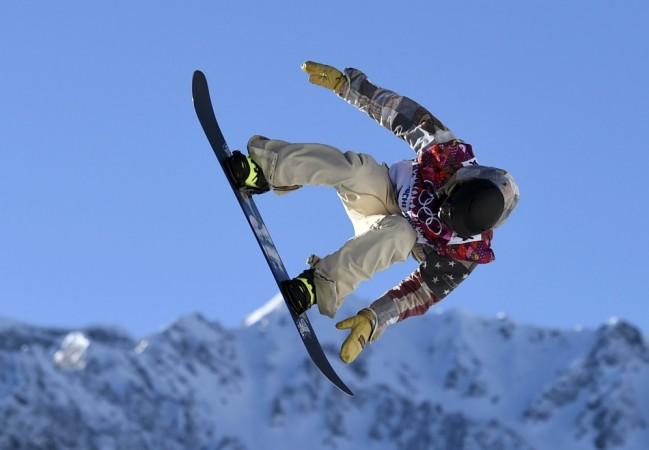 Sage Kotsenburg from the U.S. performs a jump during the men's snowboard slopestyle semi-final competition at the 2014 Sochi Olympic Games in Rosa Khutor Sage Kotsenburg