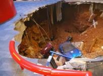 a-40-foot-sinkhole-that-opened-up-under-the-national-corvette-museum-and-swallowed-eight-corvettes-including-the-historic-1992-white-1-millionth-corvette-in-bowling-green-kentucky-february-12-2014-is-seen-in-this-handout-provided-by-the-museum