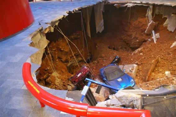 A 40-foot sinkhole that opened up under the National Corvette Museum and swallowed eight Corvettes, including the historic 1992 White 1 Millionth Corvette, in Bowling Green, Kentucky February 12, 2014 is seen in this handout provided by the museum.