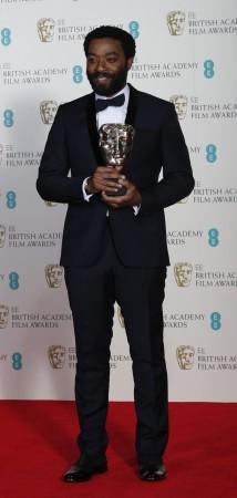Chiwetel Ejiofor celebrates after winning Best Actor for "12 Years a Slave" at the BAFTA awards ceremony in London
