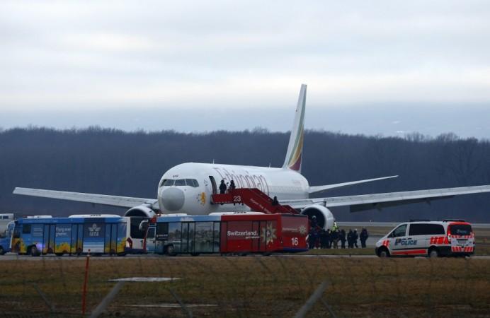 Police officers stand around hijacked Ethiopian Airlines flight ET 702 at Cointrin airport in Geneva