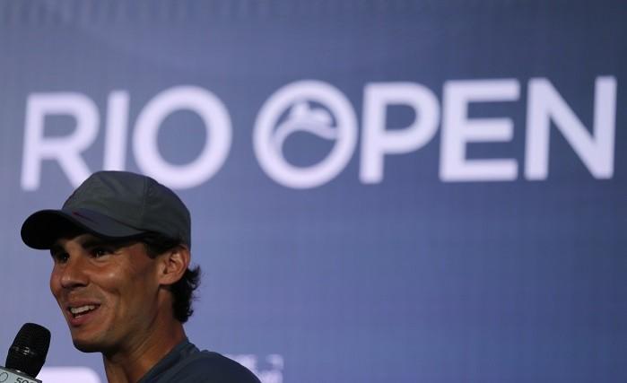 Rafael Nadal smiles as he addresses the media after he arrives for the Rio Open, 14 February. Reuters. Rafael Nadal in Rio Open