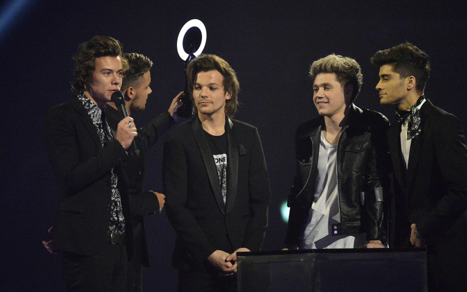 Harry Styles talks next to other members of One Direction after being presented with the British Video award at the BRIT Awards in London One Direction