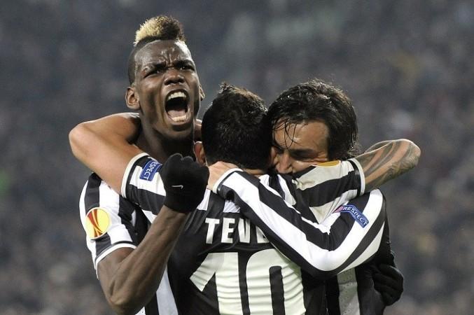 Juventus midfielder Paul Pogba celebrates with teammates Carlos Tevez and Andrea Pirlo after scoring against Trabzonspor in the Europa League, 20 February. Reuters Paul Pogba Pirlo Tevez Juventus