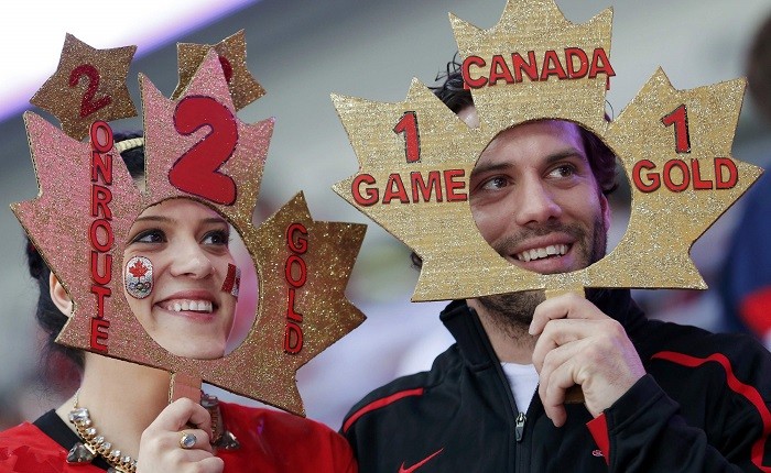 Fans of Canada are seen with cut-outs of their national symbol of maple leaf ahead of their women's ice hockey gold medal game against U.S. at Sochi 2014 Winter Olympic Games, 20 February. Maple Faces