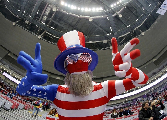 Fan of U.S. dressed in costume in colours of their national flag gestures ahead of their women's ice hockey gold medal game against Canada at Sochi 2014 Winter Olympic Games, 20 February. Colours of America