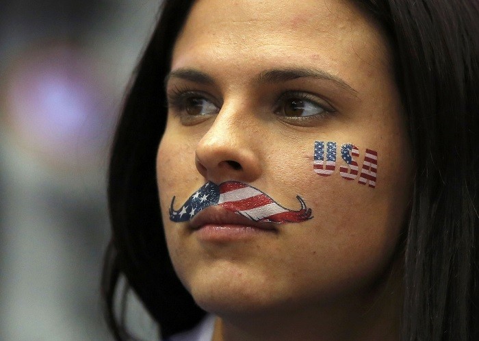 A fan of Team USA wears face paint during the women's ice hockey gold medal game against Canada at the 2014 Sochi Winter Olympics, 20 February. One Face, Many Emotions