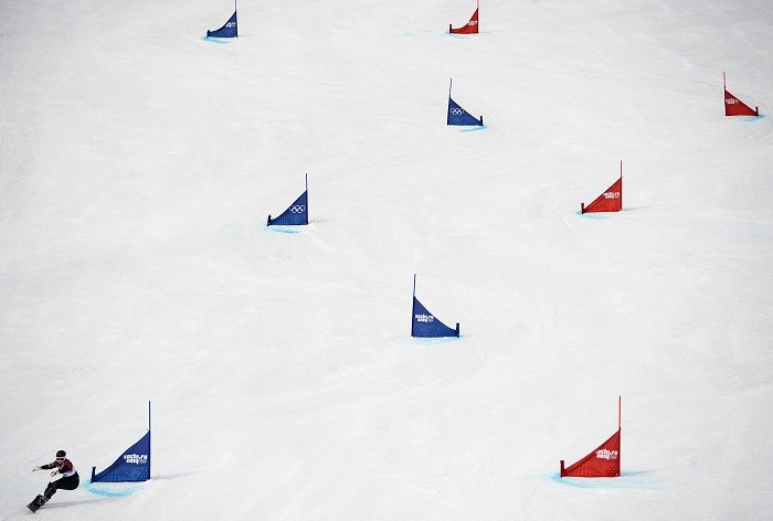 Italy's Nadya Ochner competes during the women's snowboard parallel giant slalom qualification run at the 2014 Sochi Winter Olympic Games in Rosa Khutor, 19 February. Red and Blue