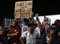 a-demonstrator-holds-a-banner-during-one-of-the-many-protests-around-brazils-major-cities-in-sao-paulo-reuters