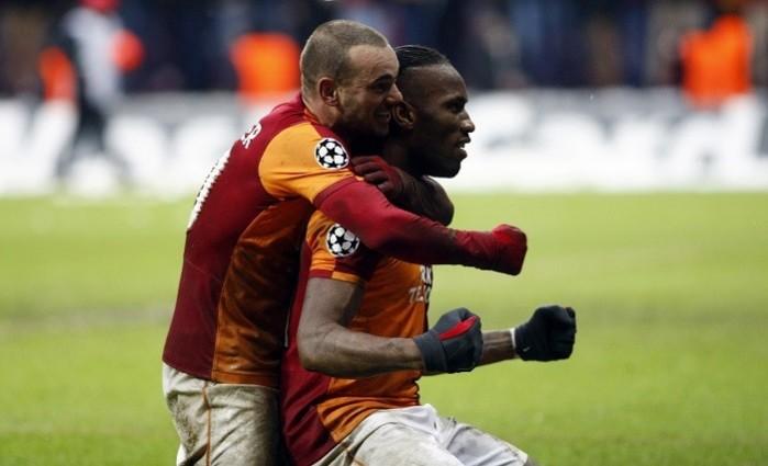 Didier Drogba and Welsey Sneijder celebrate their victory over Juventus in the Champions League, 13 December, 2013. Reuters Drogba Snaijder Galatasaray
