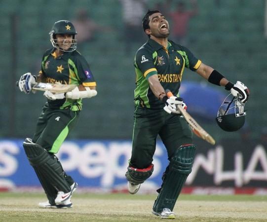 Umar Akmal is ecstatic after completing his century against Afghanistan, 27 February. Reuters Umar Akmal Saeed Ajmal Pakistan