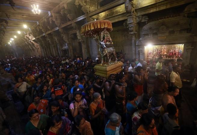Hindu devotees pray while carrying a statue of Lord Shiva during the annual Maha Shivaratri festival at Shivam Kovil in Colombo Hindu devotees pray while carrying a statue of Lord Shiva during the annual Maha Shivaratri festival at Shivam Kovil in Colombo February 27, 2014