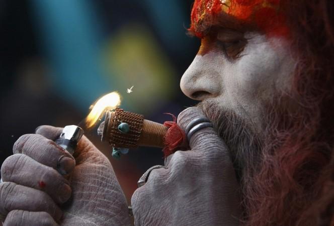 A Hindu holy man, or sadhu, smokes marijuana on a chillum (pipe) at the premises of Pashupatinath Temple during the Shivaratri festival in Kathmandu A Hindu holy man, or sadhu, smokes marijuana on a chillum (pipe) at the premises of Pashupatinath Temple during the Shivaratri festival in Kathmandu February 27, 2014.