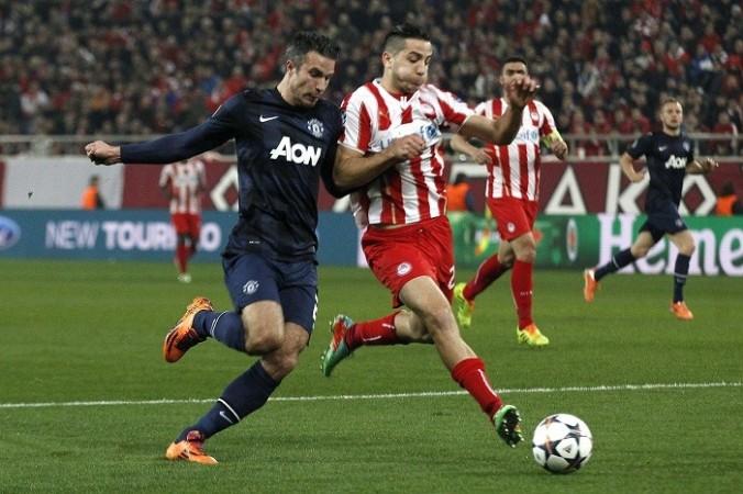 Robin Van Persie in action against Olympiakos, 25 February. Reuters Robin Van Persie Manolas Manchester United Olympiakos